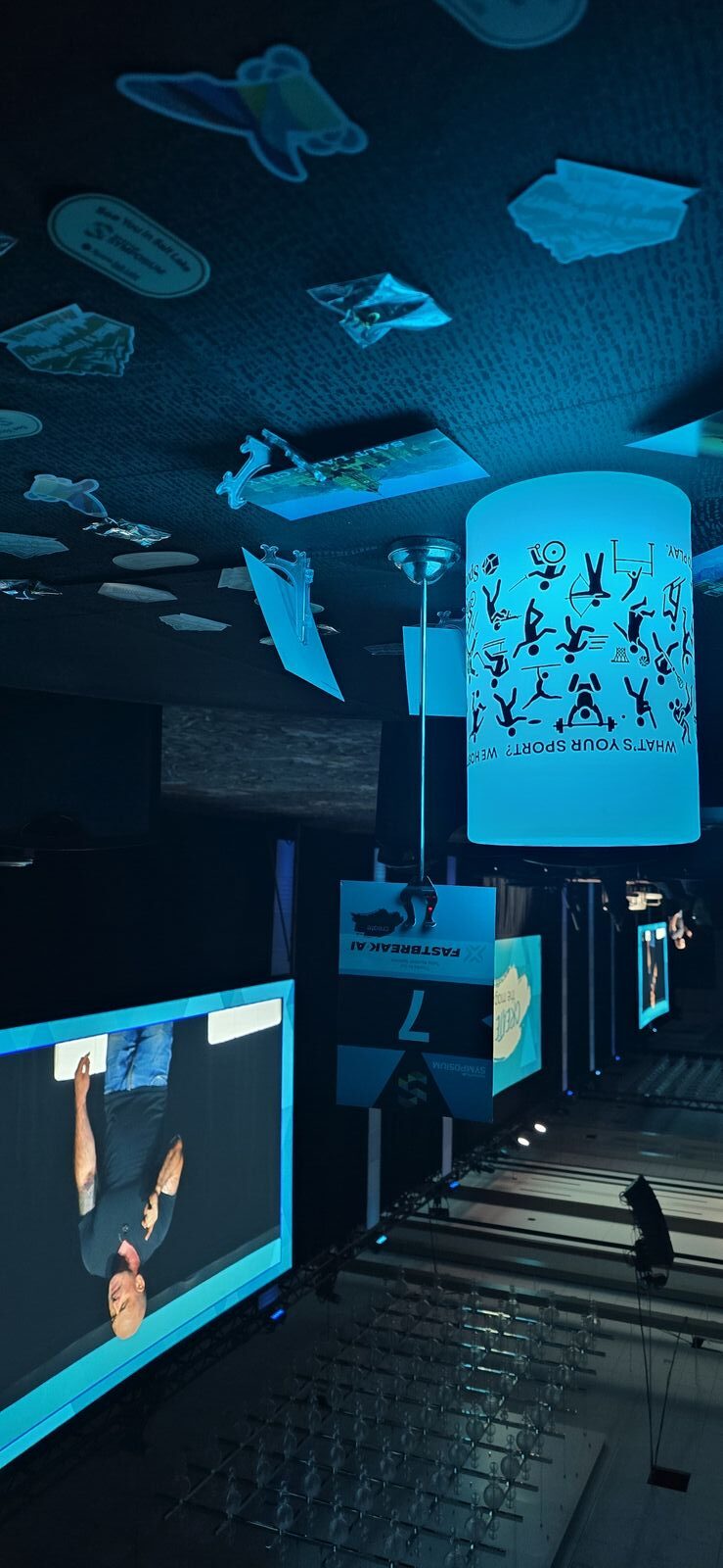 Attendees learning about Raqball at the booth